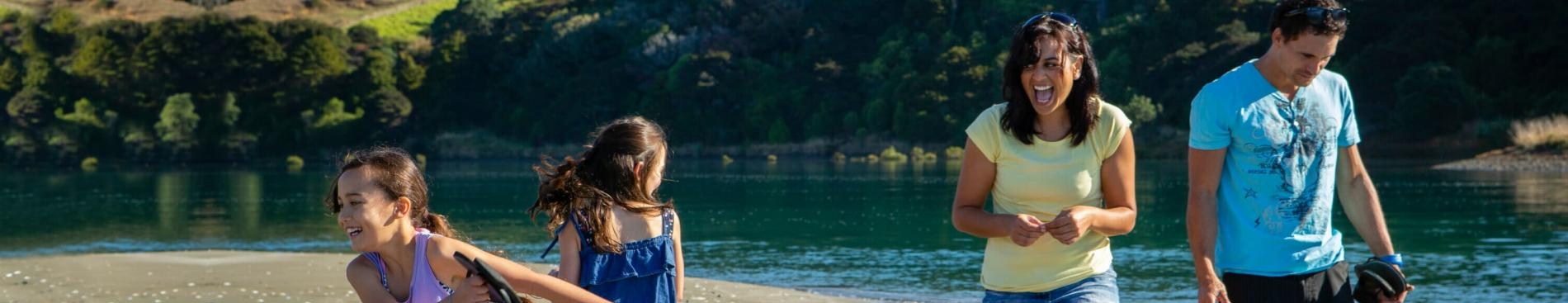 Family enjoying quality time outdoors near water in New Zealand
